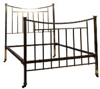 An Edwardian brass double bed; with railed ends and curved top rails,