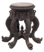 A carved hardwood circular Anglo-Indian jardiniere stand,