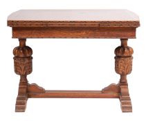 An oak draw leaf extending dining table in the 16th-century taste;