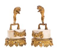 A pair of Regency ormolu and marble mounted ornaments or stands modelled with hounds,