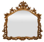 A Rococo style gilt composite wall mirror,