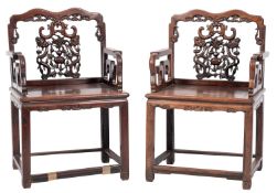 A pair of 19th-century Chinese huanghuali wood open armchairs;