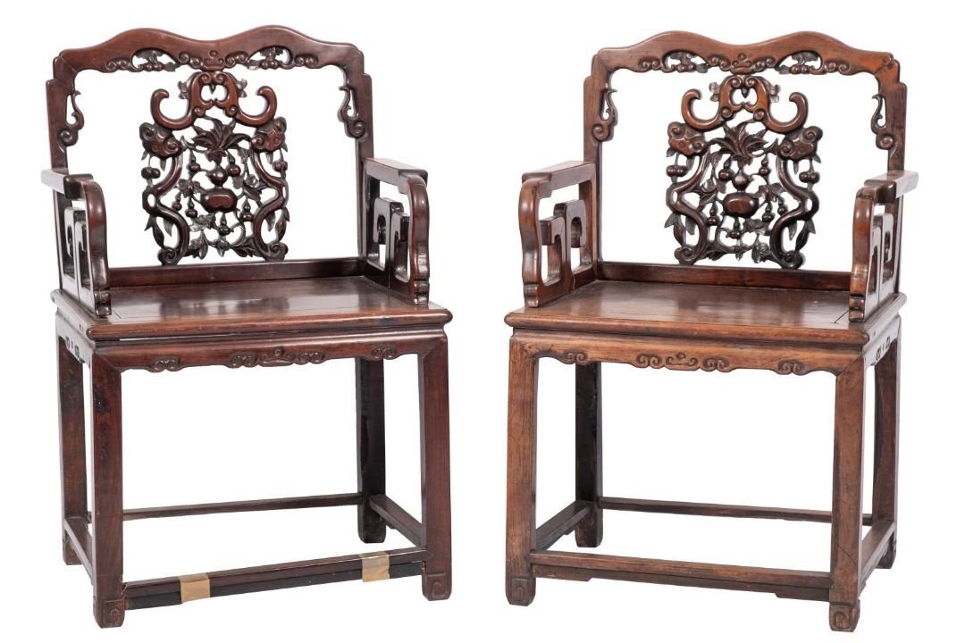 A pair of 19th-century Chinese huanghuali wood open armchairs;