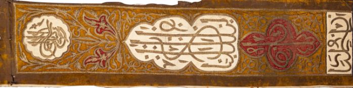 An Ottoman metal-thread and silk embroidered inscribed hanging or cover with three calligraphic