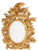 An imposing 19th Century Florentine carved giltwood mirror;
