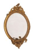 A gilt composition framed oval three-light girandole, in Rococo revival style,