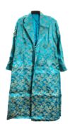 Two Chinese silk embroidered dresses worked overall with designs of flower sprays on green and