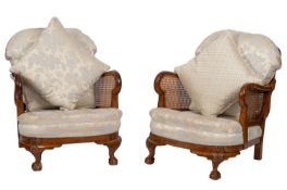 A carved walnut three-piece bergere suite,