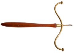 An Edwardian brass mounted mahogany hanger, purportedly for a barrister's wig and gown,
