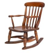 A Victorian child's elm and beechwood stickback rocking Windsor elbow chair;