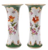 A pair of Dresden porcelain beaker vases painted in the Meissen style with floral sprays and sprigs