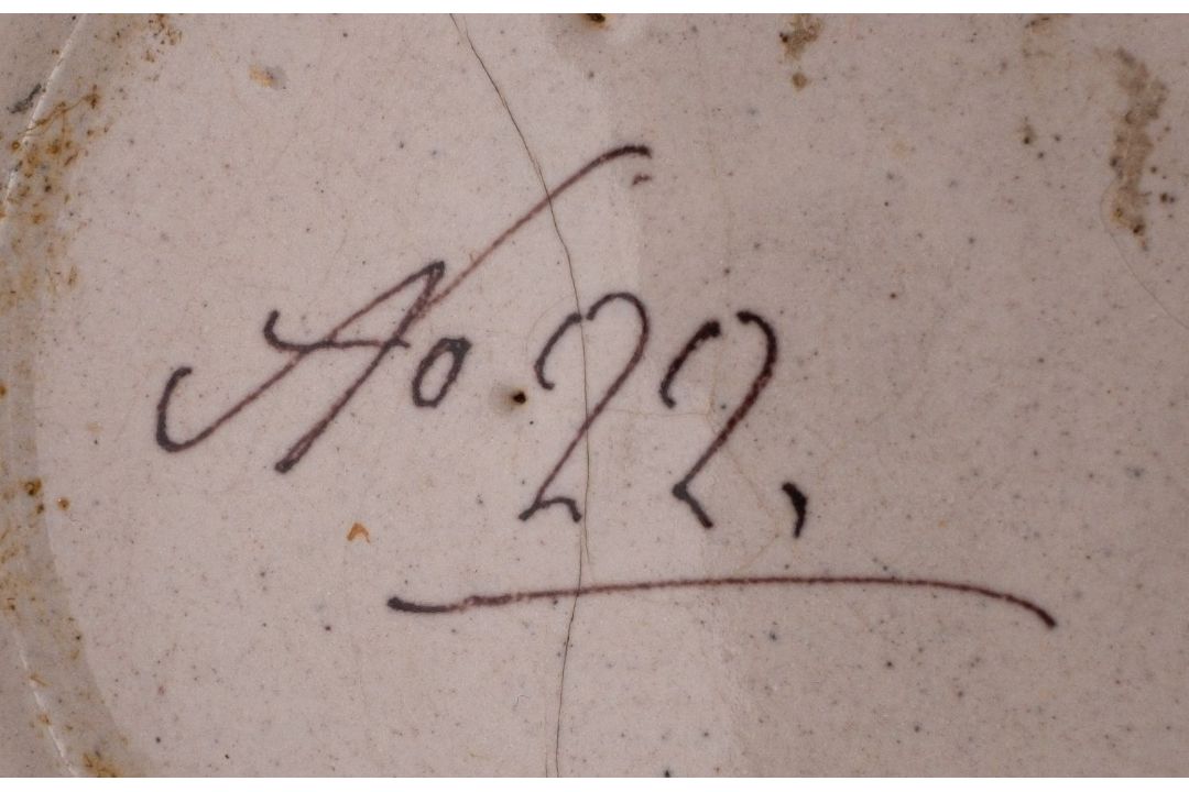 A Castelli maiolica albarello painted with scrolling flowers and foliage, the base inscribed 'No22', - Image 2 of 2