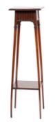 An Edwardian mahogany torchere stand; the rectangular top with moulded edge,