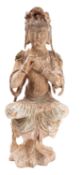 A Chinese carved and painted wood seated figure of Guanyin the folds of her robes draped over the