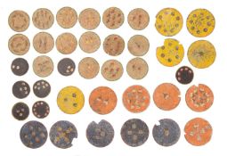 A collection of Indian Ganjifa painted playing cards decorated with equestrian figures and fruit,