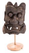 WITHDRAWN A large Tibetan carved and stained wood 'Krodha' mask; the fierce deity with open mouth,