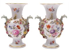 A pair of Meissen flower encrusted baluster vases with fluted rims and acanthus scroll handles,
