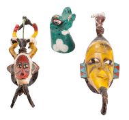 Two African carved and polychrome painted wood masks, 20th century; of stylised form,