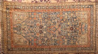 A Melayer rug, the shaded powder blue field with all over geometric floral foliate designs,