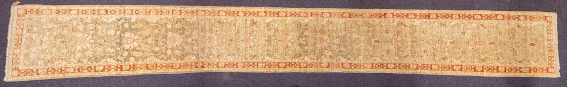 A Turkish runner, the pistachio field with a repeated design of palmettes,
