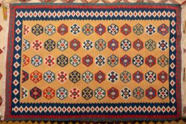 A Kashgai Kelim, the camel field with an all over design of hexagonal geometric medallions,