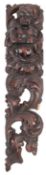 A carved and stained walnut herm, early 17th century; relief carved with a torso length male figure,