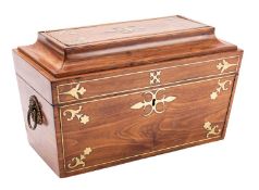 A George IV hardwood, probably padouk and brass inlaid tea caddy, circa 1825; of sarcophagus form,