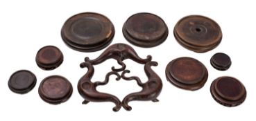 A small group of Chinese carved wood stands