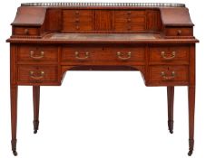 An Edwardian satinwood and inlaid Carlton House writing desk;