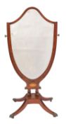 An Edwardian mahogany and inlaid shield shaped swing-frame cheval mirror; cross-banded in satinwood,