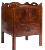 A George III mahogany square tray top commode, the shaped gallery with pierced carrying handles,