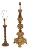 An Italianate pressed brass table lamp; with turned and triangular section column,
