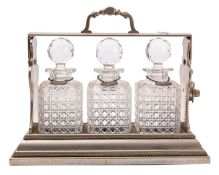 A Victorian silver plated metal tantalus, by Betjemann of London,