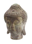 A Nepalese bronze head of Buddha with eyes downcast in contemplation, the hair in tight curls, 25cm.