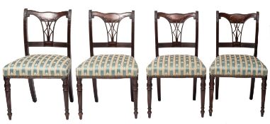 A set of four Edwardian mahogany and upholstered side chairs in Regency style,
