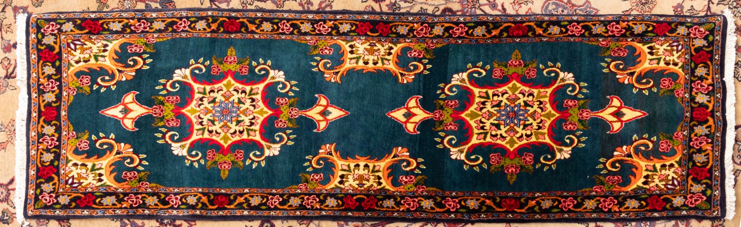 A Sarouk runner,