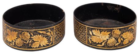 A pair of Regency parcel gilt black papier mâché bottle coasters,