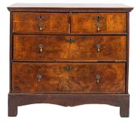An early 18th Century walnut and oak rectangular chest, on a later oak stand,
