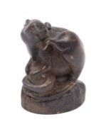 A Chinese bronze figure of a rat, modelled seated on a pile of coins protecting a nut,