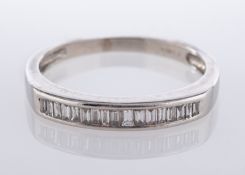 A platinum, diamond quarter-eternity ring, pave set with baguette cut stones, ring size N,