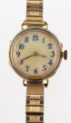 WITHDRAWN An 18k gold and enamel wristwatch the translucent dial with blue Arabic numerals and gold