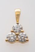 An 18ct gold, round brilliant-cut diamond, three-stone pendant, total estimated diamond weight ca.