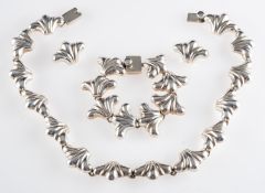 A Mexican silver coloured necklace, composed of polished scalloped panels, stamped 925, TC-89,