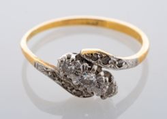 An 18ct gold diamond cross-over ring,