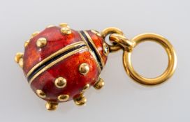 A red and black enamel ladybird charm, with diamond eyes, stamped '750',