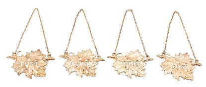 A set of four Elizabeth II silver gilt decanter labels, S.M.