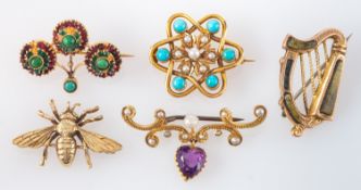 Five brooches, including inter alia a 9ct gold bee brooch; a Connemara marble harp brooch,