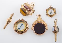 A small collection of miscellany, including two 9ct gold, swivel seal fobs, a 9ct gold compass,
