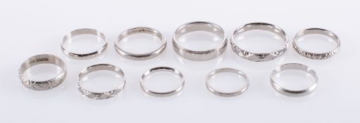 A group of ten platinum wedding bands, five pain and five with engraved decoration,