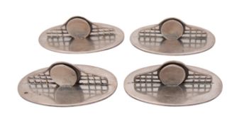 A set of four George V silver place holders, Harrods Ltd, London 1928, the oval bases,